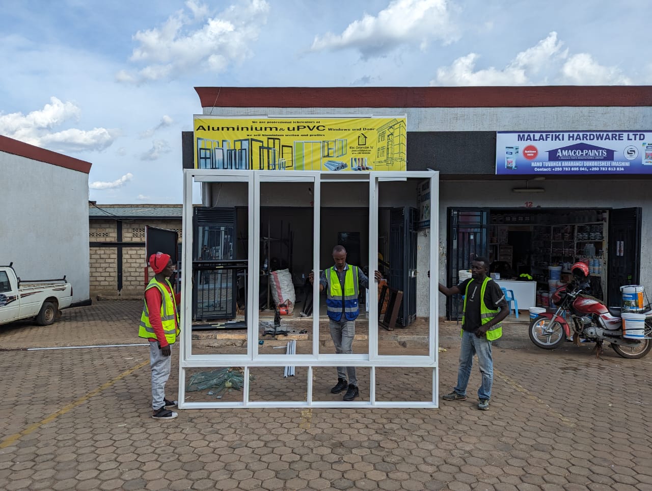 Wasi Corporation team assembling an aluminium window frame