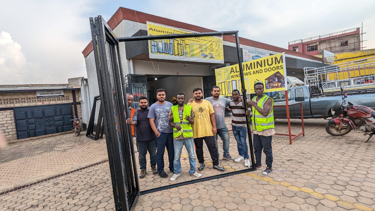 Wasi Corporation team carrying a finished door frame